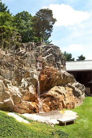 5 Willow Road Weston, MA 02493 - Photo 5 of 20 a view of a terrace with a bench