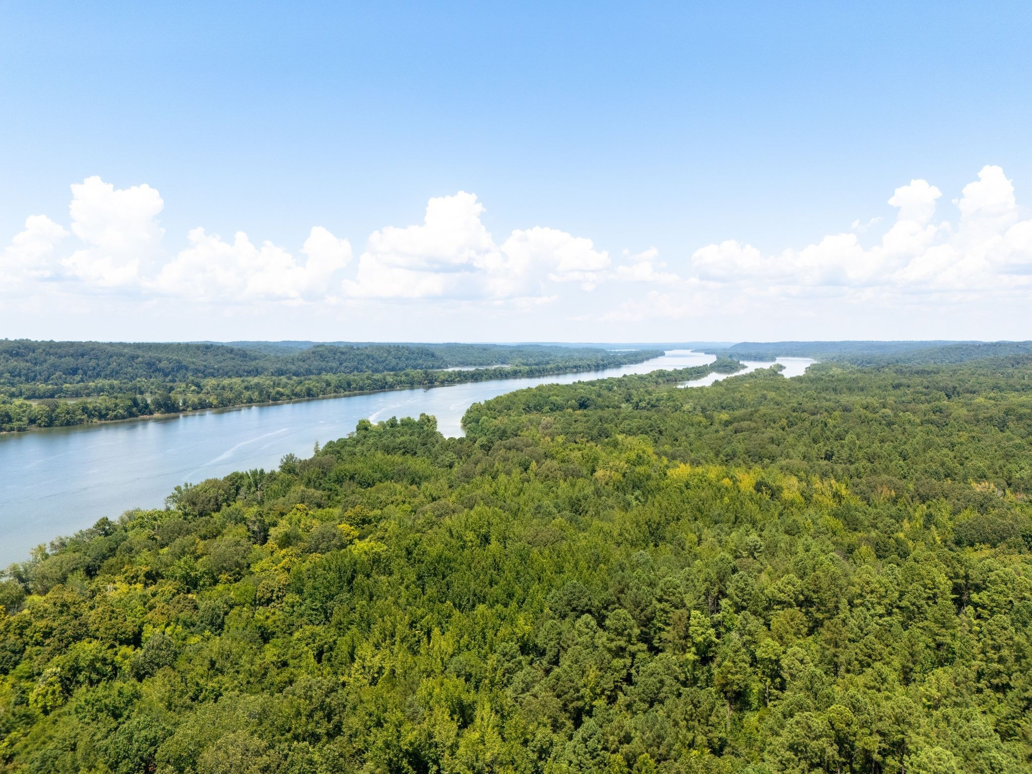 425 Dyer Road Hurricane Mills, TN 37078 - Photo 19 of 36 a view of a lake with houses in back