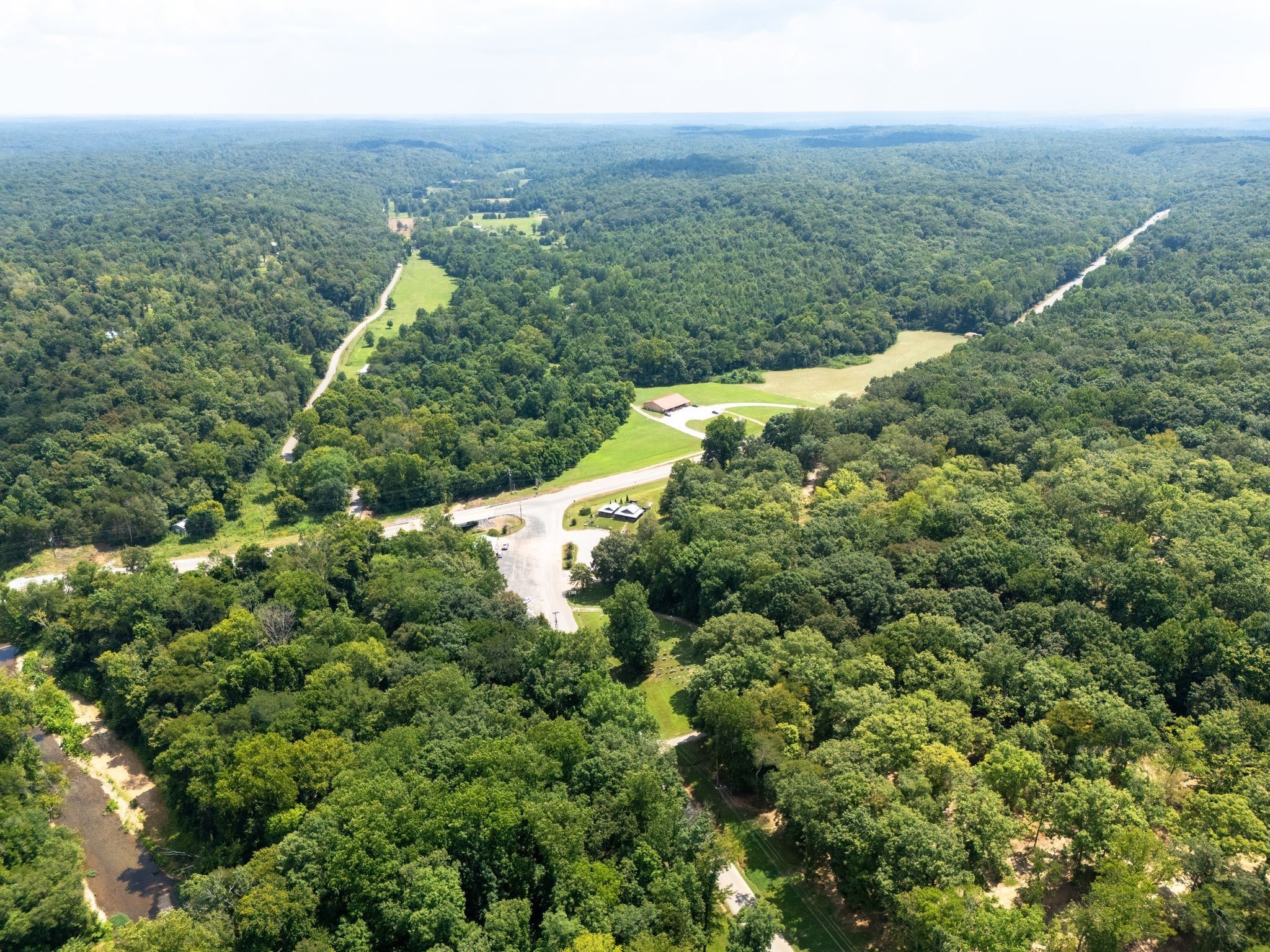425 Dyer Road Hurricane Mills, TN 37078 - Photo 20 of 36 an aerial view of residential house with green space