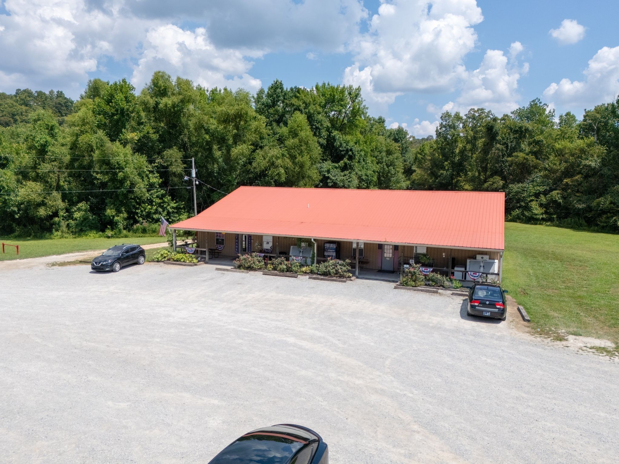 425 Dyer Road Hurricane Mills, TN 37078 - Photo 27 of 36 a view of a terrace with a garden and trees