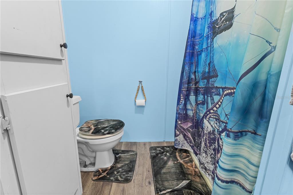 1650 Lyman Hendry Road, Unit 2 Perry, FL 32347 - Photo 12 of 26 a bathroom with a toilet and a shower