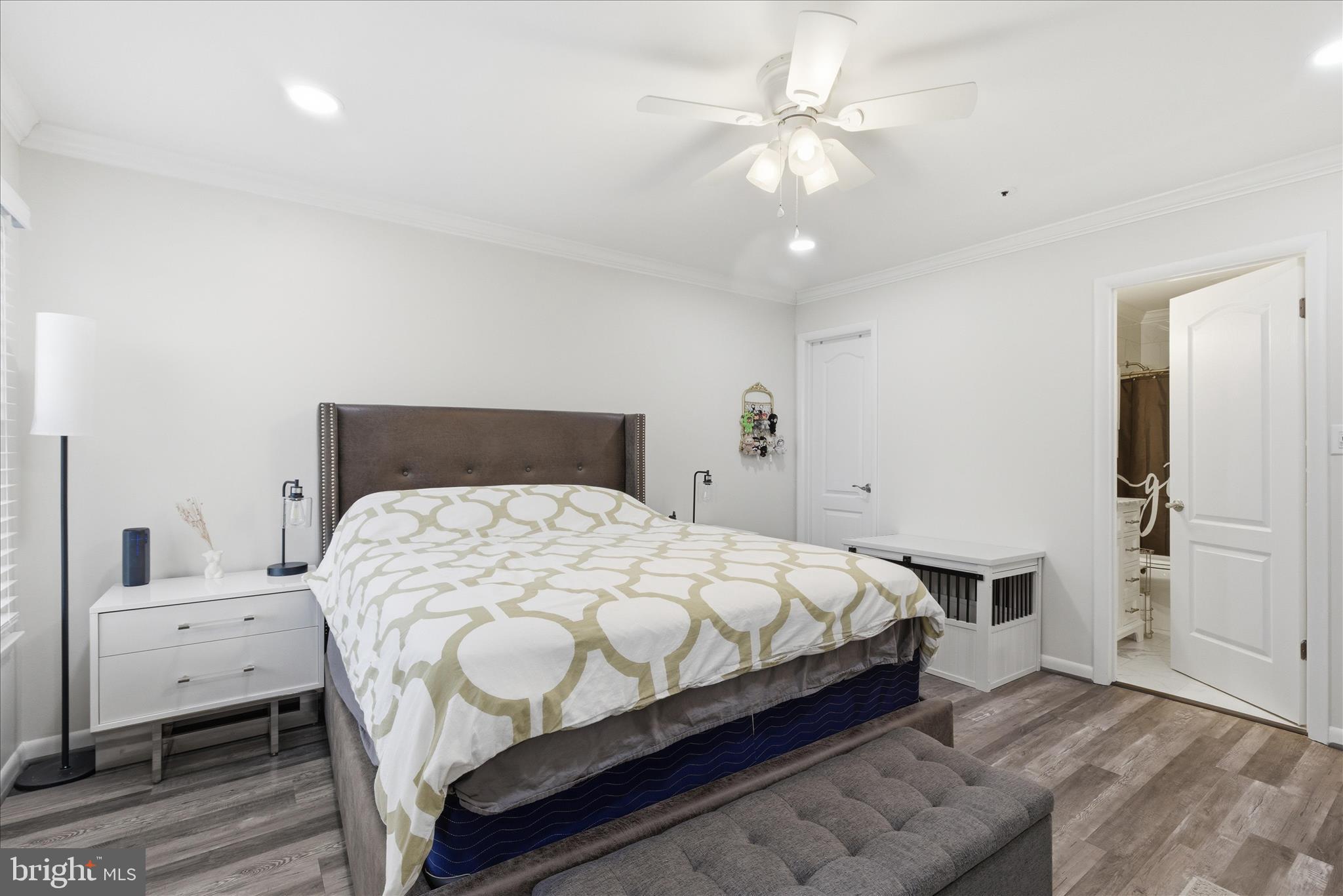 1008 Spring Valley Court Fort Washington, MD 20744 - Photo 19 of 25 a bedroom with a bed and a chandelier