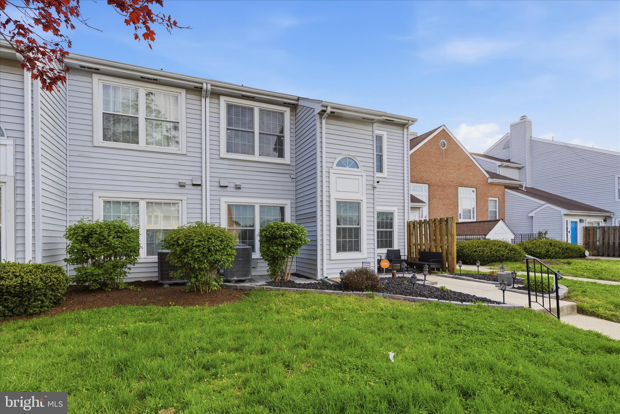 1008 Spring Valley Court Fort Washington, MD 20744 - Photo 2 of 25 a front view of a house with a yard