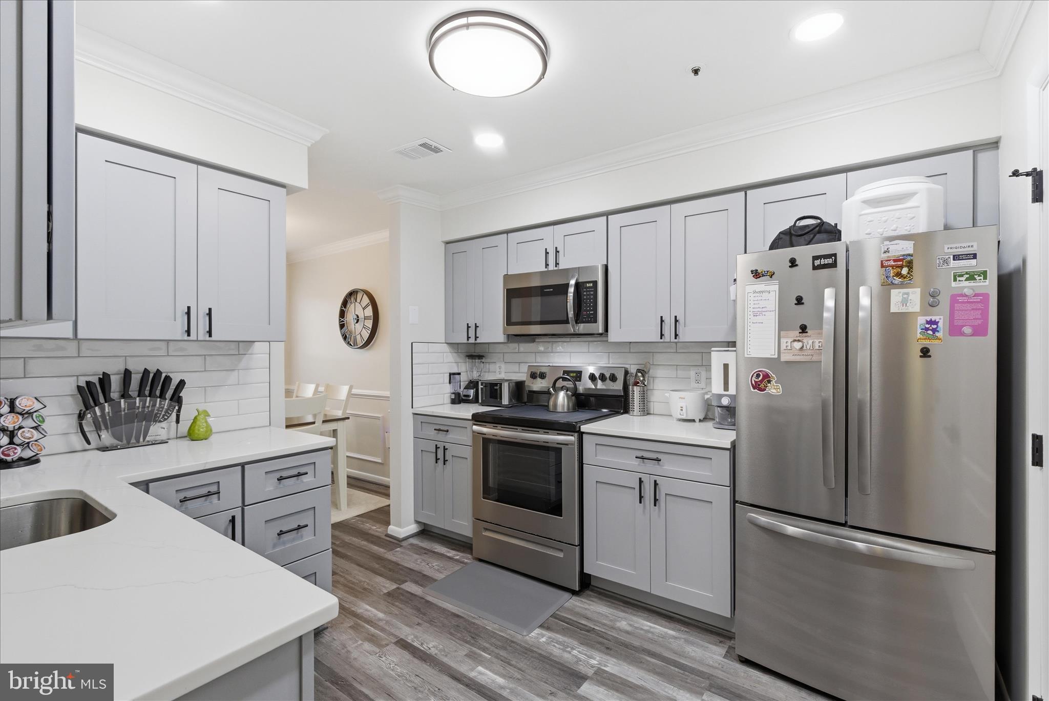 1008 Spring Valley Court Fort Washington, MD 20744 - Photo 9 of 25 a kitchen with cabinets stainless steel appliances and sink