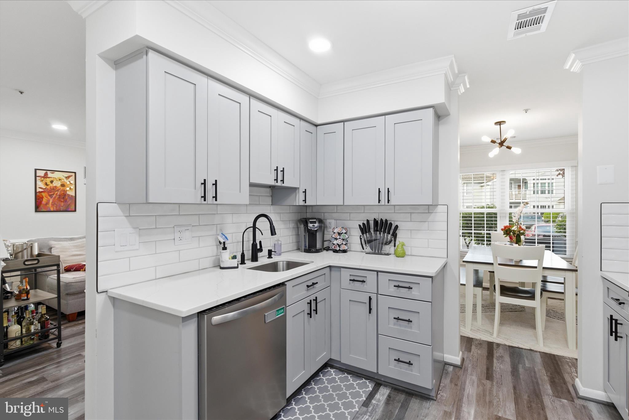 1008 Spring Valley Court Fort Washington, MD 20744 - Photo 10 of 25 a kitchen with a sink stove and cabinets