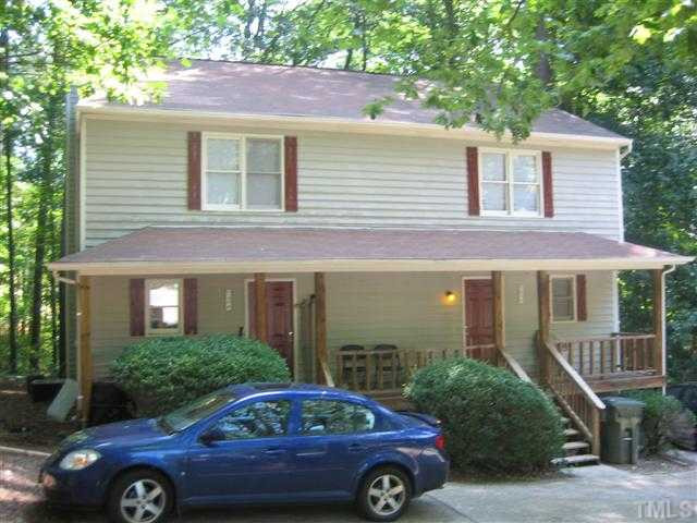 5102 Vann Street Raleigh, NC 27606 - Photo 1 of 4 a front view of a house with parking space