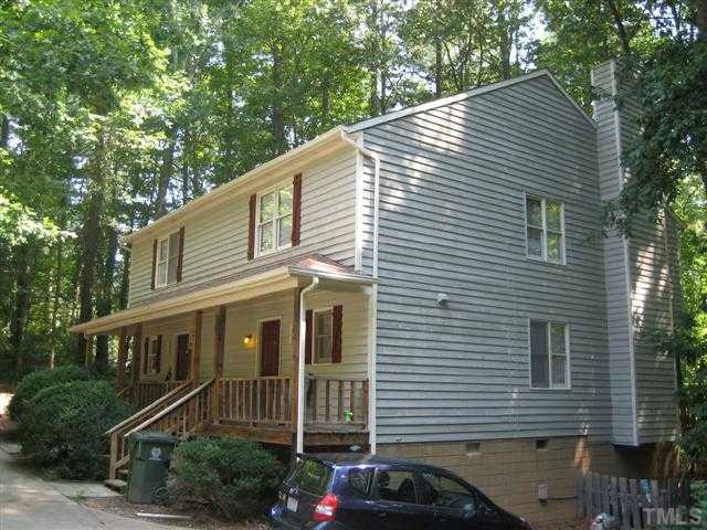 5102 Vann Street Raleigh, NC 27606 - Photo 2 of 4 a front view of a house with a yard