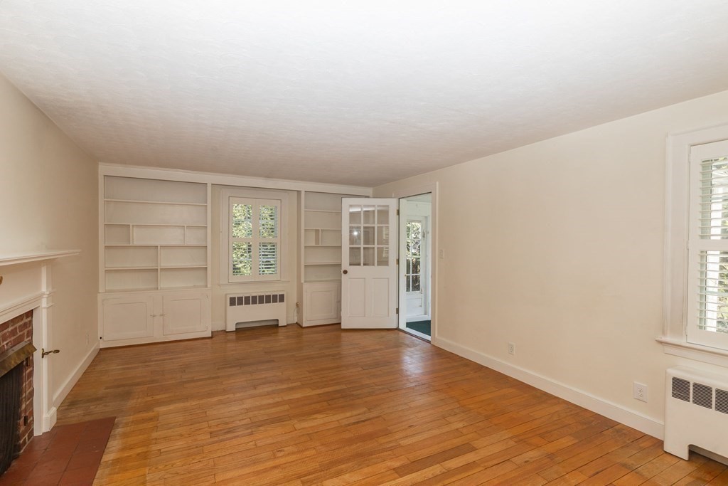 26 Hereford Road Marblehead, MA 01945 - Photo 11 of 23 wooden floor in an empty room with a window