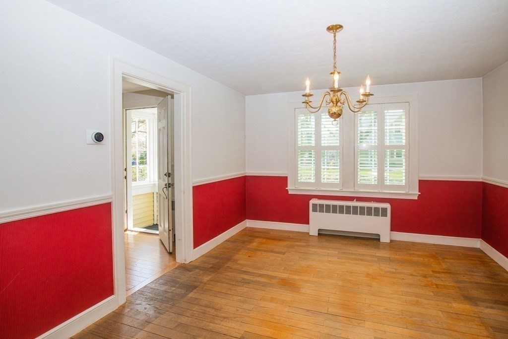 26 Hereford Road Marblehead, MA 01945 - Photo 10 of 23 a spacious bedroom with a bed and wooden floor