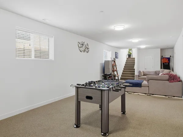 a living room with furniture and a table