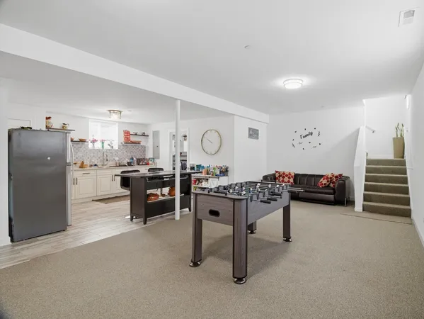 a living room with furniture and a table