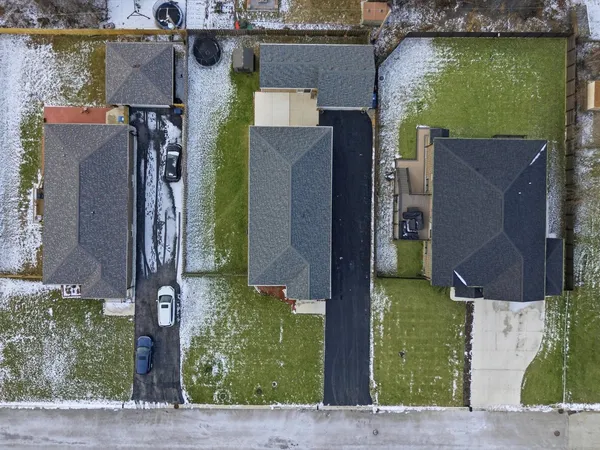 an aerial view of a residential houses with outdoor space