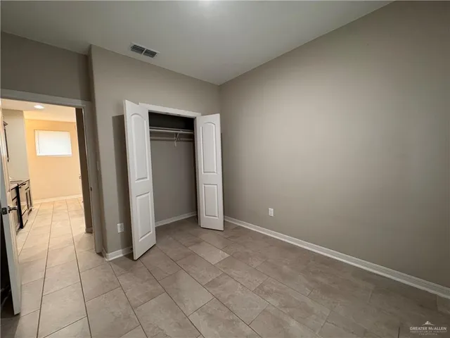 a bathroom with a granite countertop sink a toilet and bathtub
