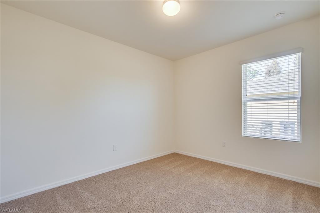 8353 Wren Road Fort Myers, FL 33967 - Photo 11 of 18 an empty room with a window