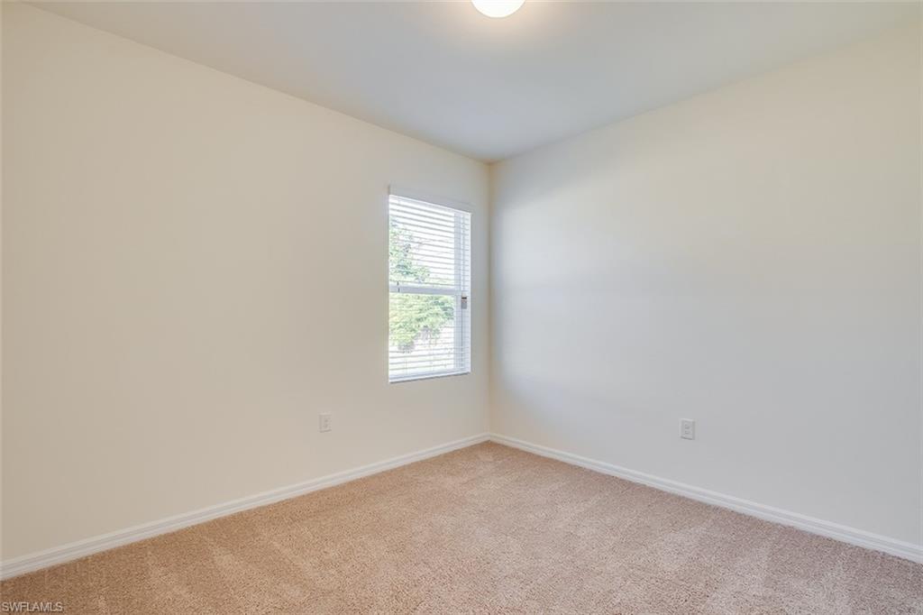8353 Wren Road Fort Myers, FL 33967 - Photo 10 of 18 an empty room with a window