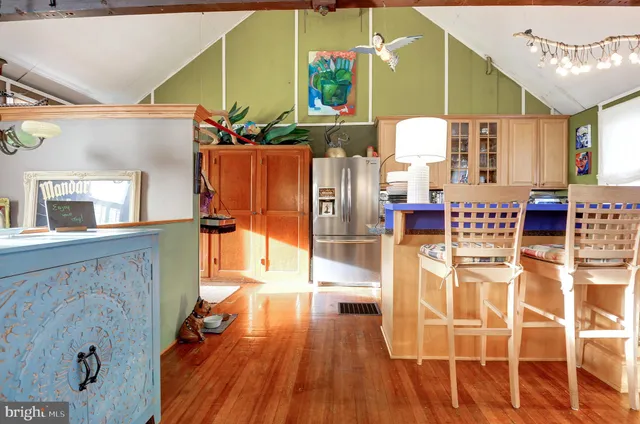 a view of kitchen with furniture and wooden floor