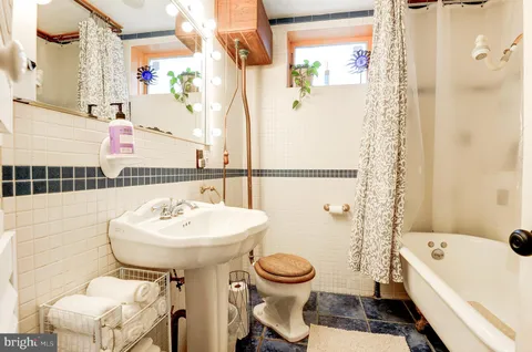a bathroom with a bathtub and shower