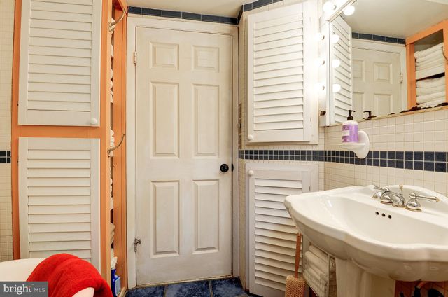 a bedroom with two beds and painted walls