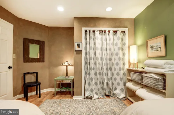 a view of a livingroom with furniture and staircase