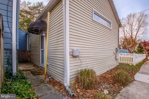 a view of a livingroom with furniture and staircase