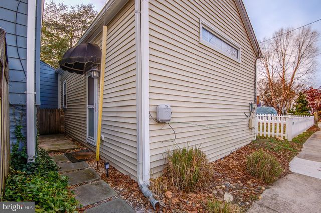 a view of a livingroom with furniture and staircase