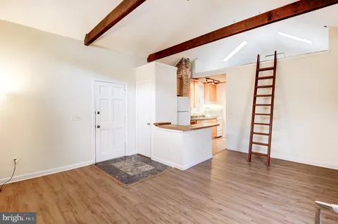 a view of workspace with wooden floor