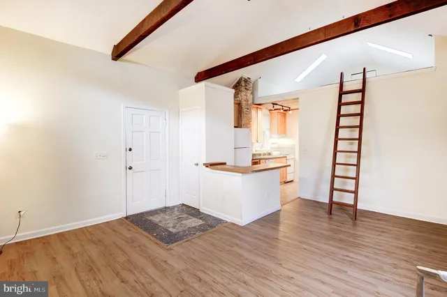 a view of workspace with wooden floor