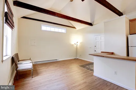 a kitchen with stainless steel appliances granite countertop cabinets and a window