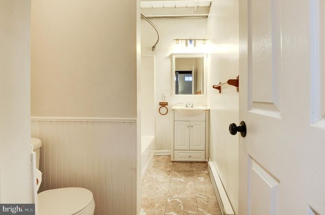 a view of an empty room with windows