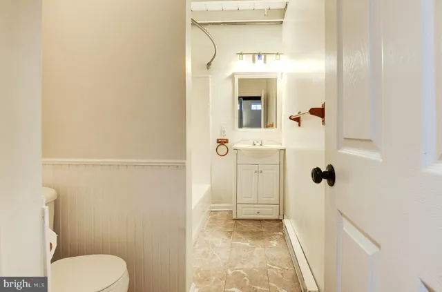 a view of an empty room with windows