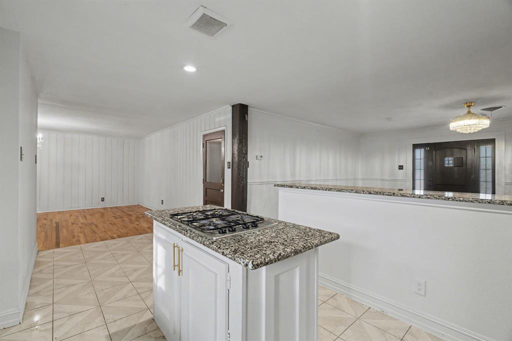 1714 East Union Bower Road Irving, TX 75061 - Photo 13 of 32 a kitchen with a sink stove and refrigerator