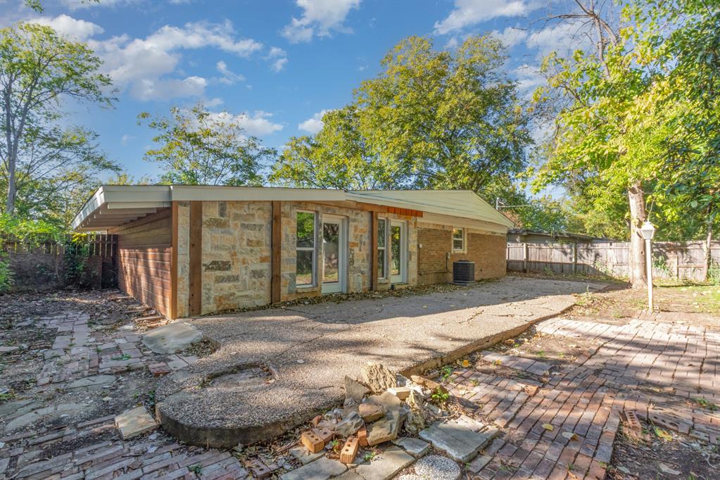 1912 South Harvard Street Irving, TX 75061 - Photo 18 of 19 a front view of a house with a garden