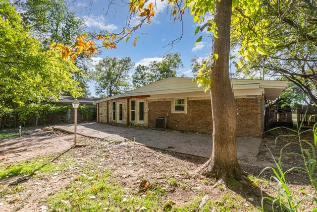 a house with trees in front of it