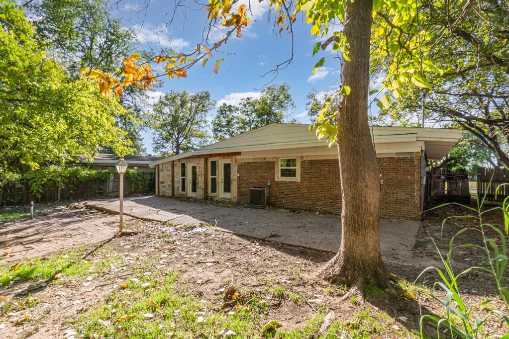1912 South Harvard Street Irving, TX 75061 - Photo 19 of 19 a house with trees in front of it