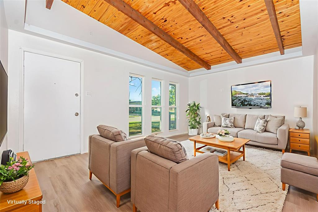 1912 South Harvard Street Irving, TX 75061 - Photo 2 of 19 a living room with furniture and a potted plant