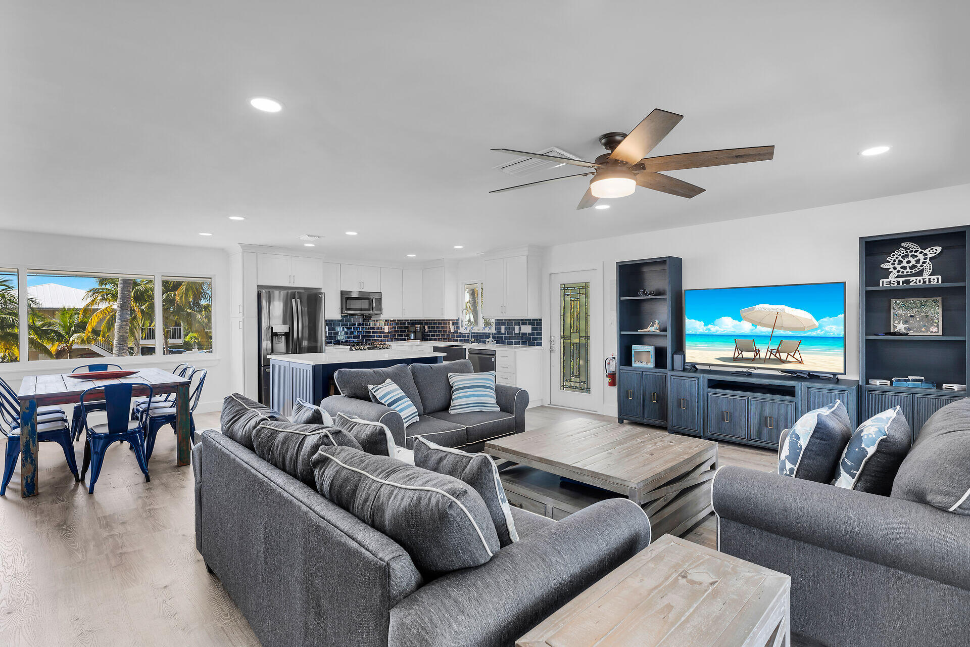 138 Brian Road Marathon, FL 33050 - Photo 23 of 49 a living room with furniture and a flat screen tv with kitchen view