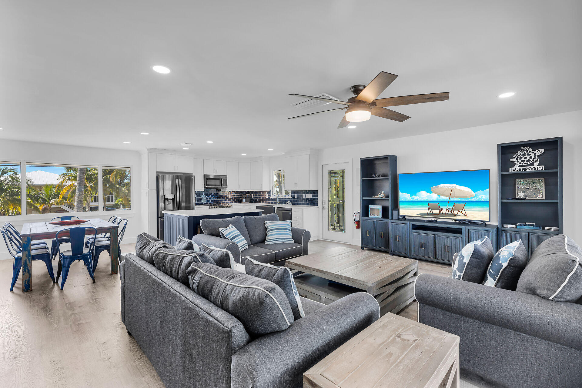 138 Brian Road Marathon, FL 33050 - Photo 25 of 49 a living room with furniture and a flat screen tv with kitchen view