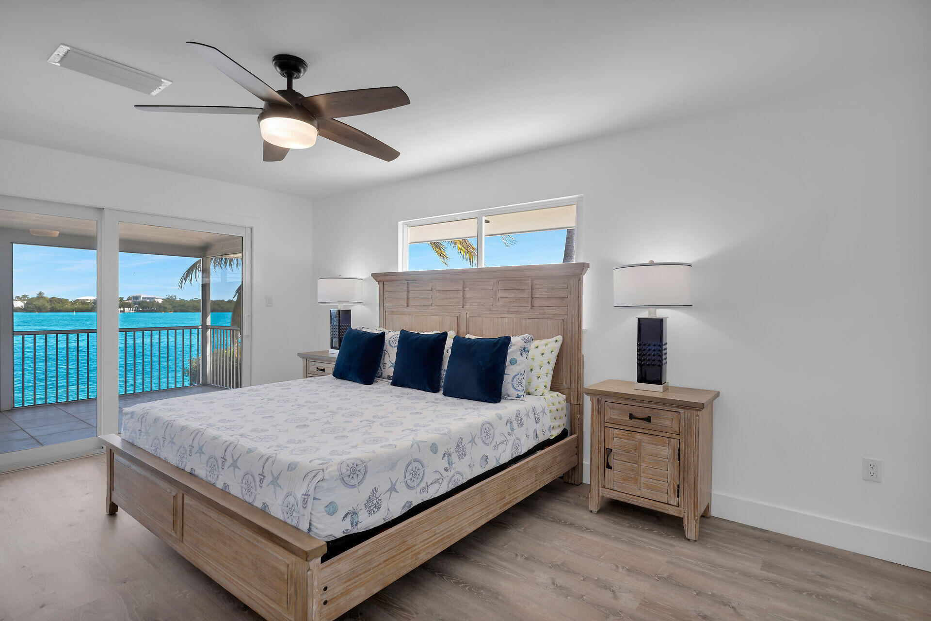 138 Brian Road Marathon, FL 33050 - Photo 33 of 49 a bedroom with a large bed and a tv on the dresser