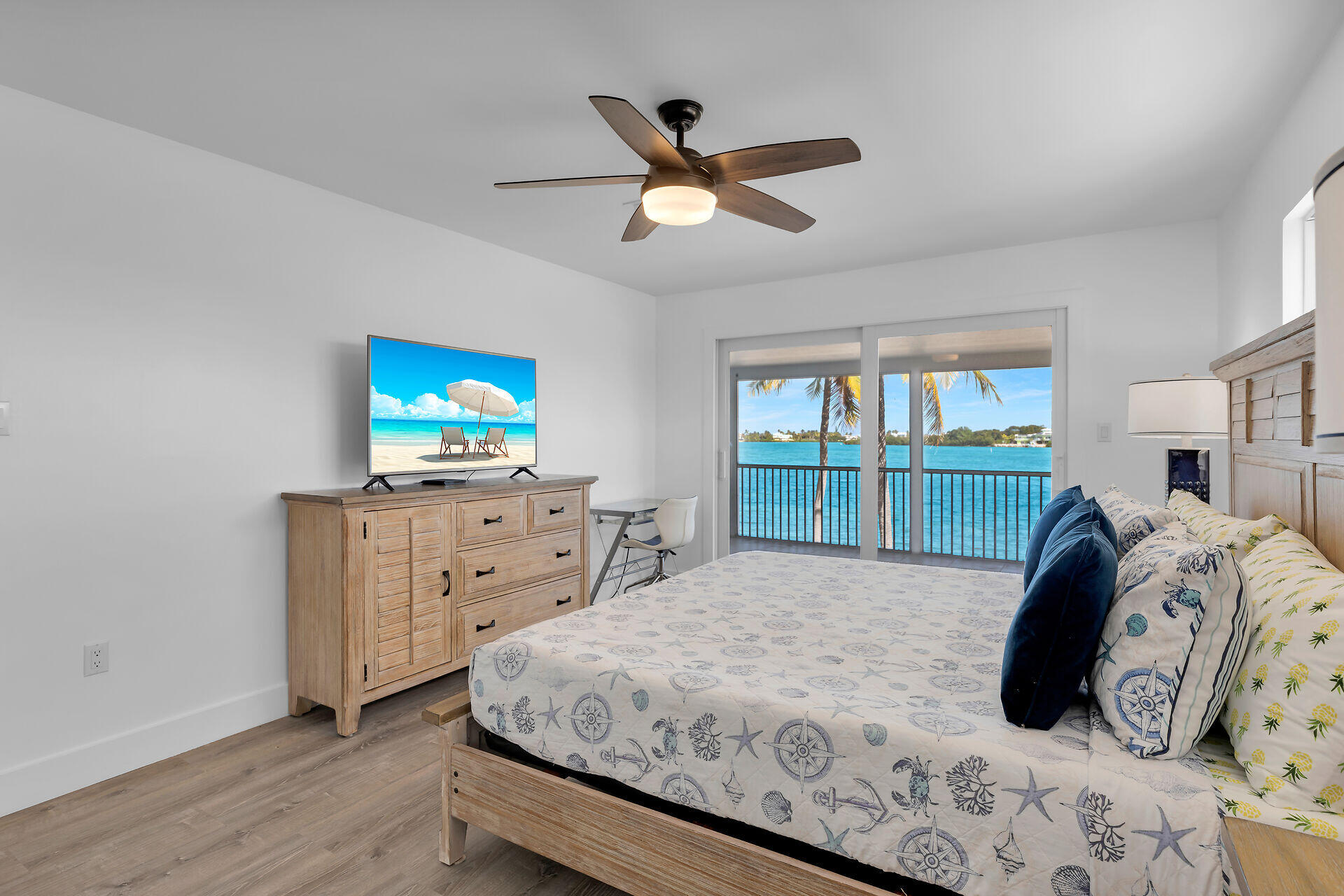 138 Brian Road Marathon, FL 33050 - Photo 34 of 49 a bedroom with a bed and a flat screen tv