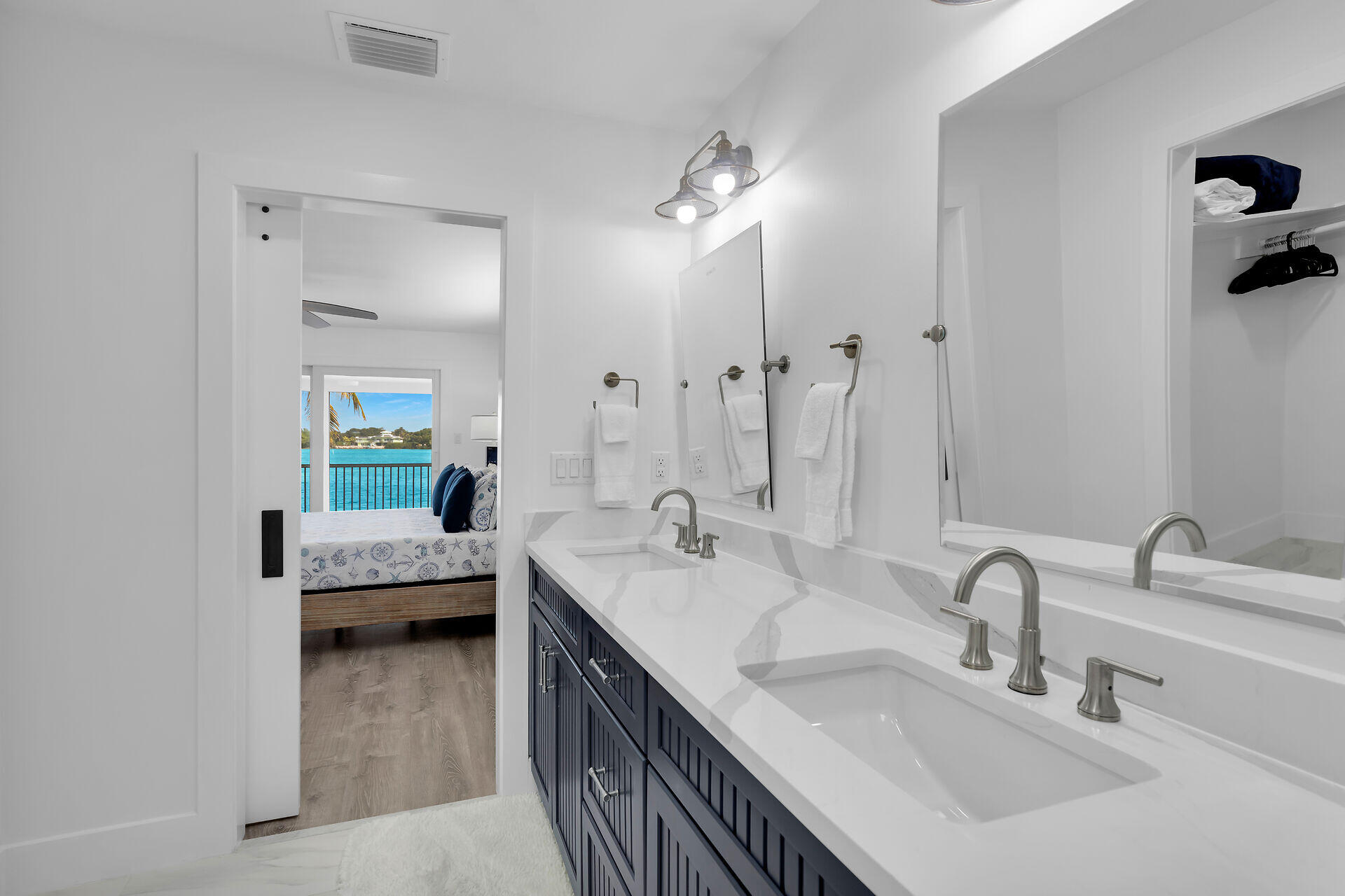 138 Brian Road Marathon, FL 33050 - Photo 39 of 49 a en suite bathroom with double vanity and a mirror