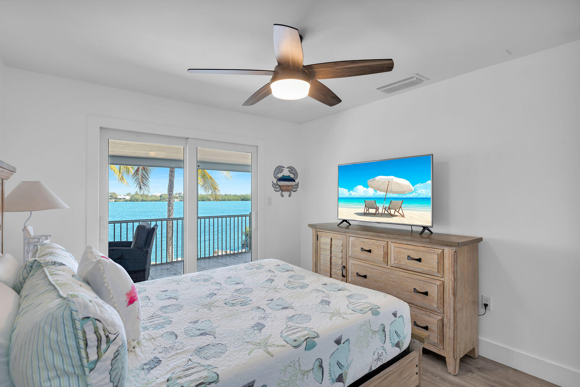 138 Brian Road Marathon, FL 33050 - Photo 42 of 49 a bedroom with a bed and a flat screen tv