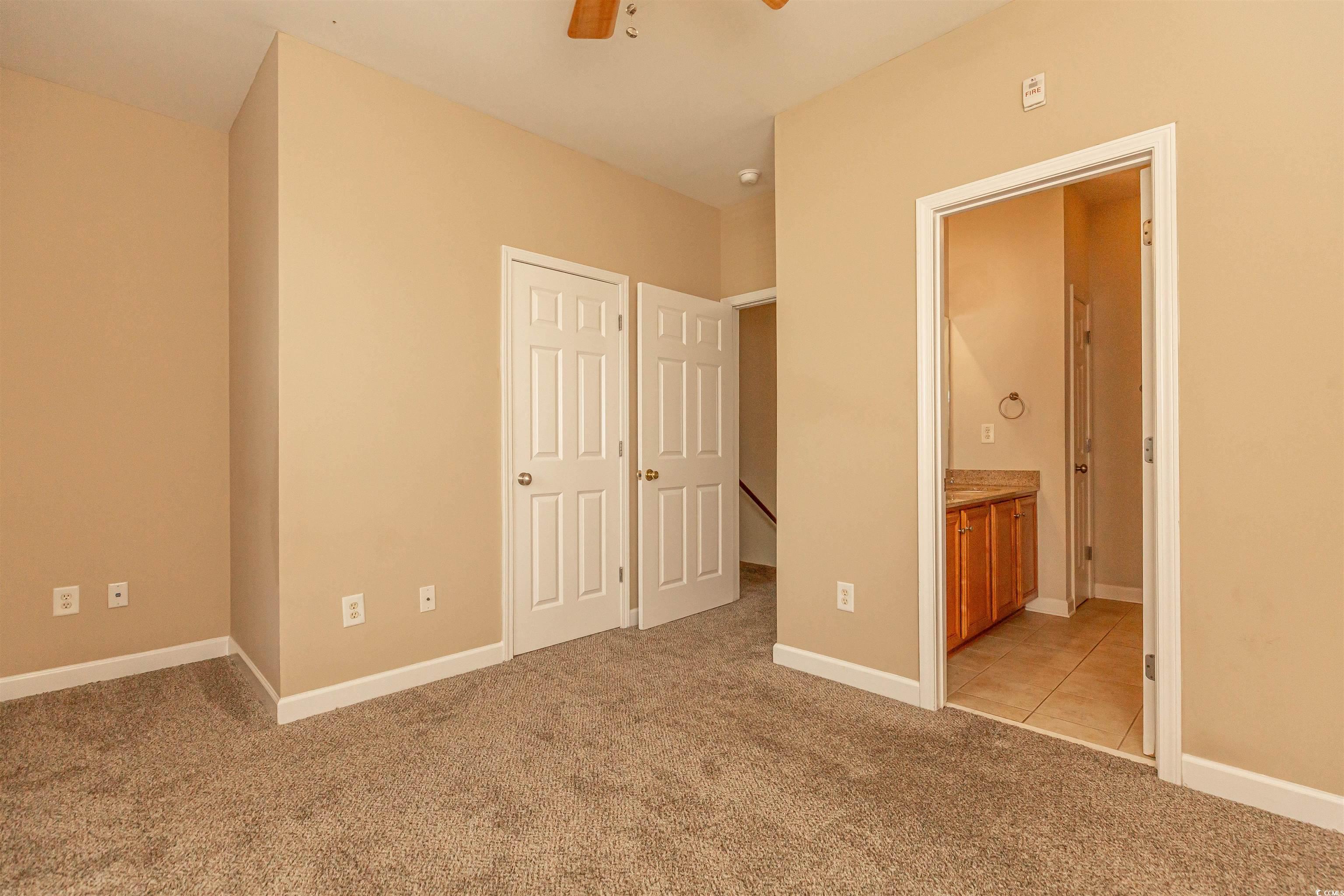 2954 Yancey Way, Unit B Myrtle Beach, SC 29577 - Photo 21 of 24 Unfurnished bedroom with baseboards, a ceiling fan