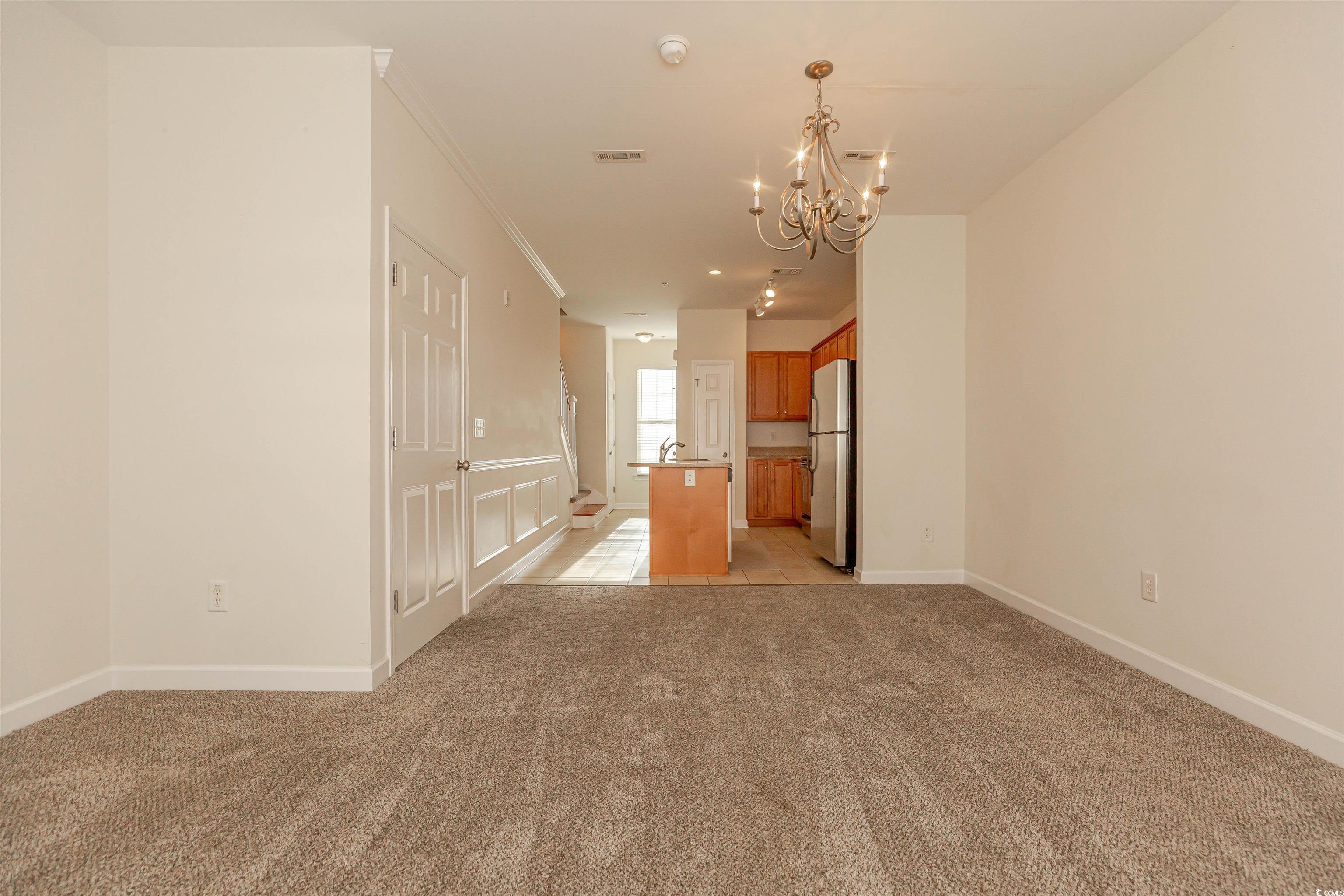2954 Yancey Way, Unit B Myrtle Beach, SC 29577 - Photo 6 of 24 Empty room with light carpet, baseboards, visible