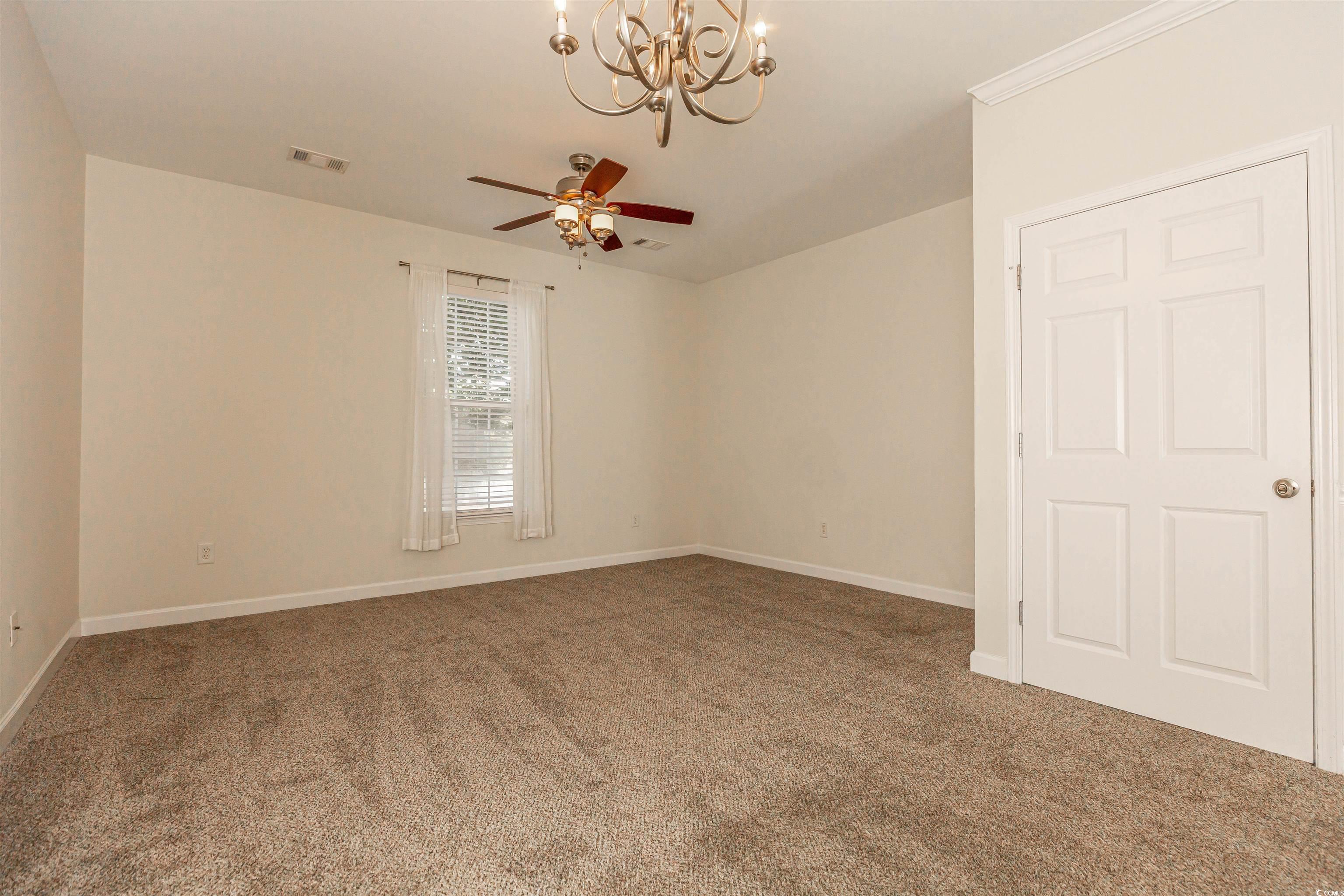 2954 Yancey Way, Unit B Myrtle Beach, SC 29577 - Photo 8 of 24 Spare room featuring ceiling fan with notable chan