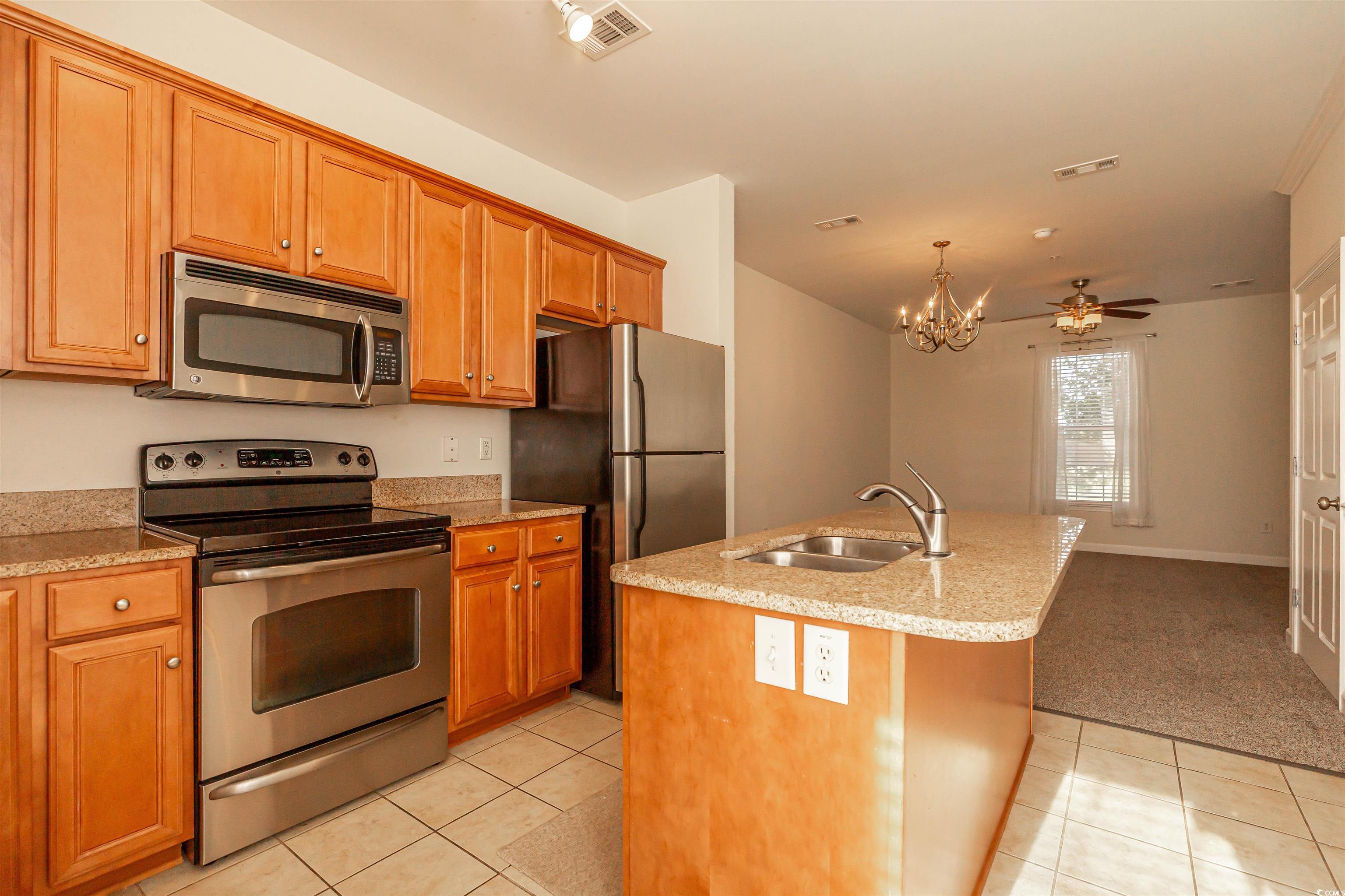 2954 Yancey Way, Unit B Myrtle Beach, SC 29577 - Photo 10 of 24 Kitchen featuring light tile patterned flooring, a