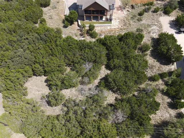 a aerial view of a house with a yard