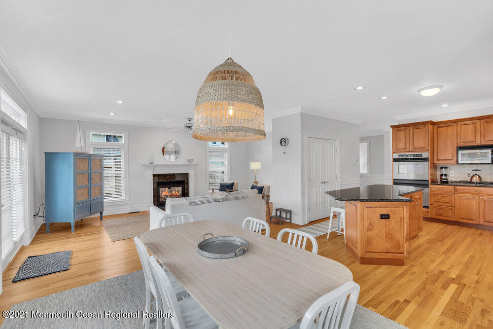 507 Washington Avenue Spring Lake, NJ 07762 - Photo 12 of 29 a living room with furniture a table and kitchen view