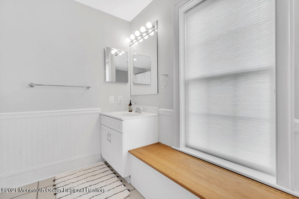 507 Washington Avenue Spring Lake, NJ 07762 - Photo 18 of 29 a bathroom with a sink and a mirror