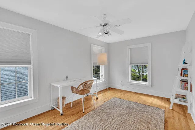a view of a livingroom with furniture and a window