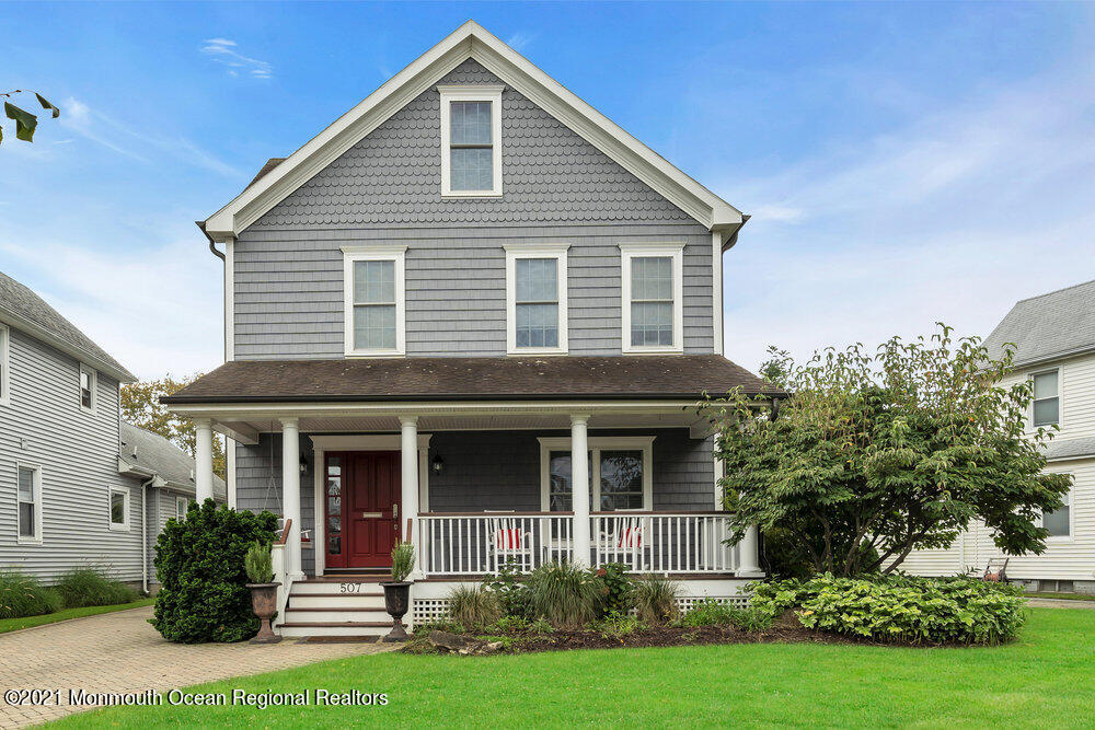507 Washington Avenue Spring Lake, NJ 07762 - Photo 2 of 29 a front view of a house with garden